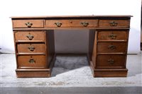 Lot 404 - A Victorian oak twin pedestal desk.