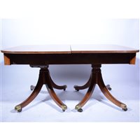 Lot 376 - Regency style mahogany twin pedestal dining table