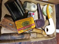 Lot 169 - A collection of old clay and briar pipes and other smoking related items.