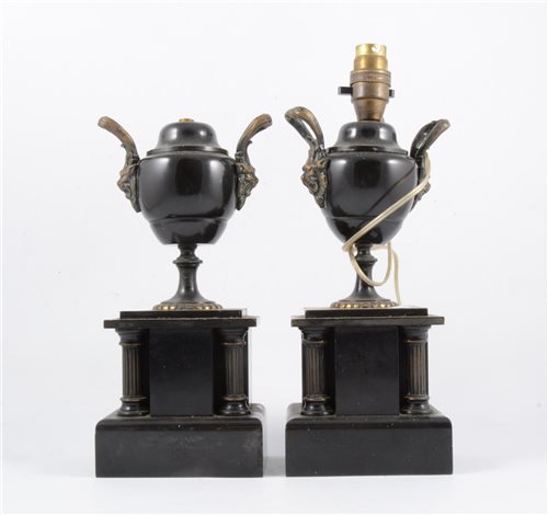 Lot 188 - A pair of black marble urns, adapted as candlesticks