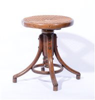 Lot 411 - Bentwood adjustable piano stool, cane seat.