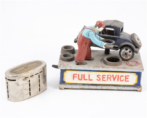 Lot 125 - "Full Service" cast iron novelty money box and a Lloyds Bank money box. (2)