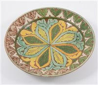 Lot 4 - A Della Robbia of Birkenhead plate, incised and painted decoration, 19cm, (chipped).
