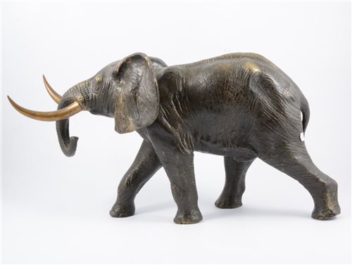 Lot 117 - Cast metal model of an elephant, 26cm high, 46cm long.