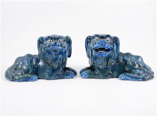 Lot 78 - A pair of Guangdong blue and green glazed lions, late Qing