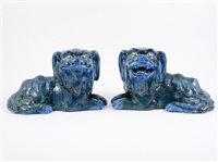 Lot 78 - A pair of Guangdong blue and green glazed lions, late Qing