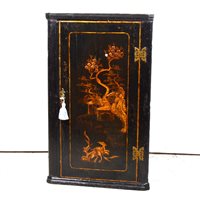 Lot 370 - George III hanging corner cupboard, black lacquered, enclosing three shelves, 92cm.