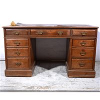 Lot 431 - An oak twin pedestal desk