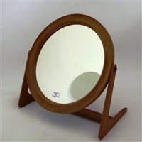 Lot 465 - A teak dressing table mirror,circular plate, on shaped stretchered supports, 39cm high