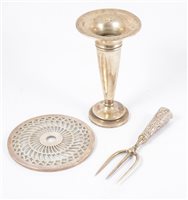 Lot 238 - A silver teapot stand, pierced design on glass, Adie Brothers Ltd, Birmingham, 1925, and a silver trumpet shaped vase, a silver handled bread fork. (3)