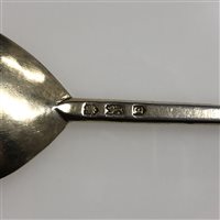 Lot 149 - Elizabeth I silver gilt seal top spoon, maker's mark a bush(?), London, 1582.