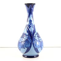 Lot 550 - A Moorcroft Pottery vase, Florian style designed by Rachel Bishop.