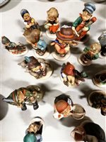 Lot 24 - A collection of sixteen Goebel Hummell figures, to include Apple Tree Boy and Girl, Meditation, For Father and Home From Market, (16).