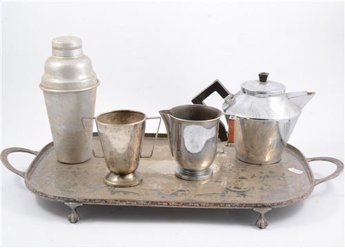Lot 162 - A Picquot Ware five piece teaset, other brass and copper wares, handbells, money box, plated wares., cocktail shaker., egg coddlers etc