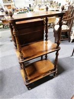 Lot 459 - A walnut three tier whatnot with turned spindles, ...