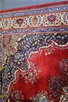 Lot 447 - A large Persian carpet