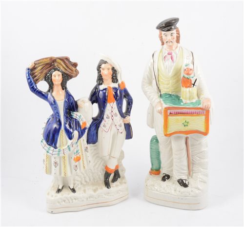 Lot 89 - Staffordshire figure, Organ Grinder, and a theatrical group (2)