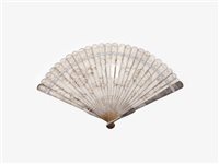 Lot 228 - A silver coloured filigree brise fan