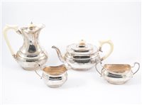 Lot 237 - A silver four piece teaset with ivory handles and finials, by Viner's Ltd, Sheffield 1937 and 1938, heavy gauge plain oval polished body on plain oval base, total gross weight approximately 56oz. (4)