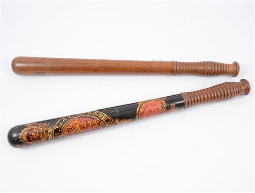 Lot 180 - A Warwickshire Constabulary decorated truncheon, painted in red and gold, with ribbed grip, 44cm, and another plain truncheon, 44cm with similar grip. (2)