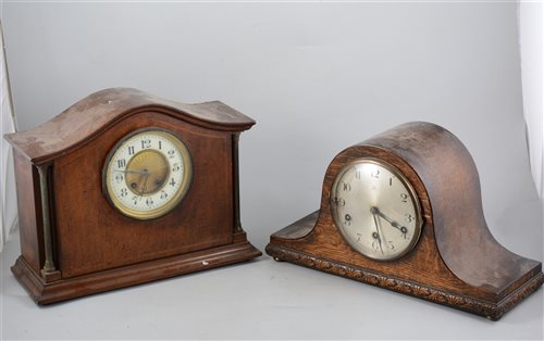 Lot 157 - Edwardian inlaid mahogany mantel clock, cylinder movement striking on a gong, 29cm and an oak mantel clock, 1930's, (2).