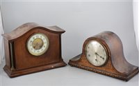 Lot 157 - Edwardian inlaid mahogany mantel clock, cylinder movement striking on a gong, 29cm and an oak mantel clock, 1930's, (2).