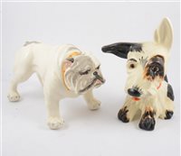 Lot 36 - Six Crown Devon dog figures, a glass eyed gloss "Sealyham Terrier" doorstop filled with sand, 18cm, three "Scottie Dogs" a 17cm sand filled doorstop with glass eyes