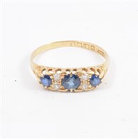 Lot 273 - A sapphire and diamond half hoop ring, three sapphires spaced by two pairs of old cut diamonds in an 18 carat all yellow gold mount, ring size U.
