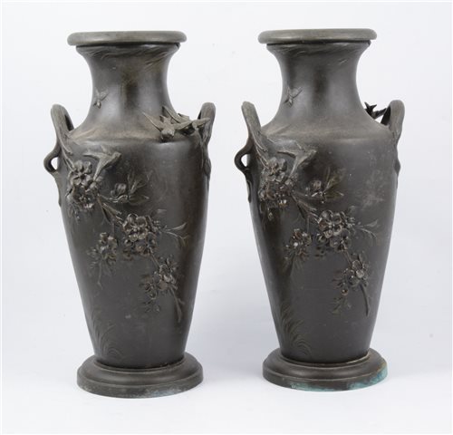 Lot 180 - After Moreau a pair of twin handled vases with birds in relief, 33cm.