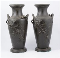 Lot 180 - After Moreau a pair of twin handled vases with birds in relief, 33cm.
