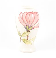Lot 3 - A Moorcroft "Pink Magnolia" baluster vase on cream ground, 26cm. impressed Moorcroft Made in England, signed in blue WM 75/94