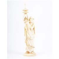 Lot 245 - A Japanese carved ivory Okimono, Meiji period