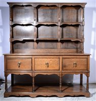 Lot 415 - An oak dresser with potboard base