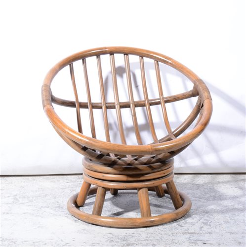 Lot 353 - A cane and rattan conservatory chair by Angraves of Leicester