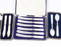 Lot 246 - A cased set of silver butter knives with mother-of-pearl handles