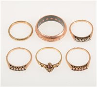 Lot 243 - Six various rings, a set of three half hoop bands - one set with six rose cut diamonds, one with six sapphires and one with six rubies all in rose metal marked 585, (missing retaining bar)