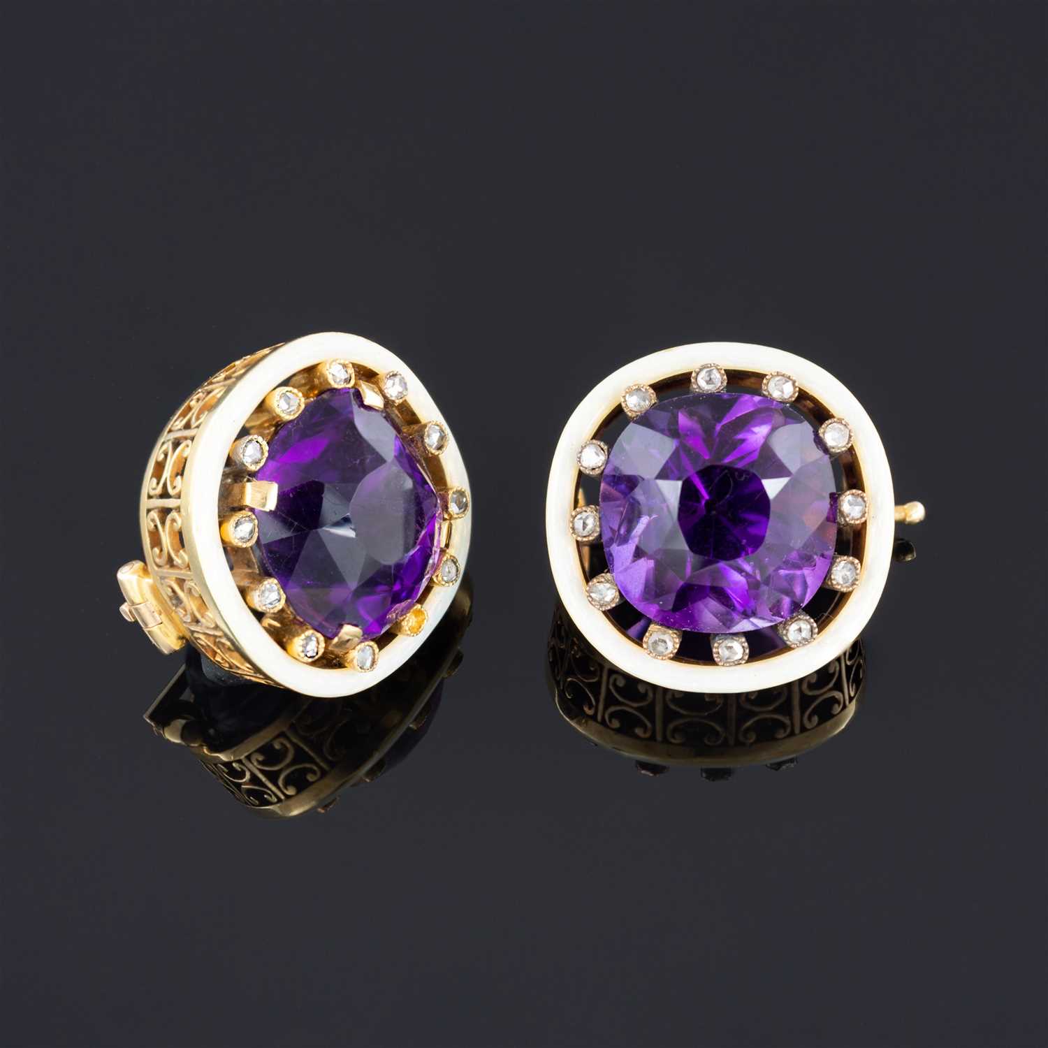 Lot 264 - A pair of Fabergé amethyst and diamond lapel brooches