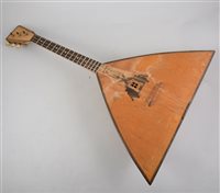 Lot 162 - A Russian three string Balalaika, pre 1900, 66cm,  in a canvas covered fitted case.