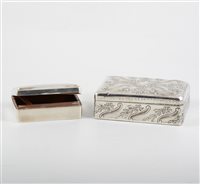 Lot 272 - Two silver cigarette/jewel boxes, cedar lined, one with embossed floral and scroll decoration around a vacant cartouche