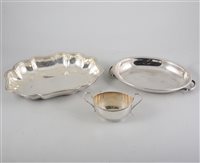 Lot 169 - A tray of silver-platedwares, three entree dishes, snuffer tray, milk jugs and sugar bowls, small mug, dessert knives and forks