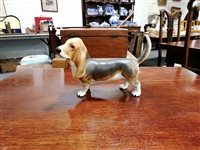 Lot 41 - A Beswick model of a Basset hound, a Winstanley model of a Siamese cat and a large collection of cat models