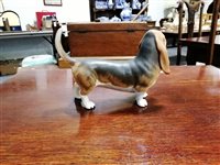 Lot 41 - A Beswick model of a Basset hound, a Winstanley model of a Siamese cat and a large collection of cat models