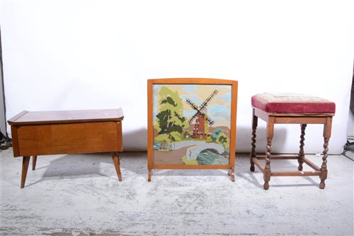 Lot 365 - An oak stool, upholstered seat, with barley twist legs; and oak framed fire screen; and a 1960s sewing box. (3)
