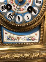 Lot 117 - French gilt spelter and bleu celeste porcelain clock garniture in the Louis XVI style.