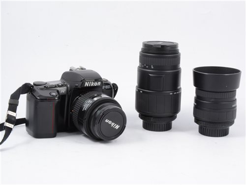 Lot 206 - Nikon F-601 SLR Camera with 4 lenses and accessories.