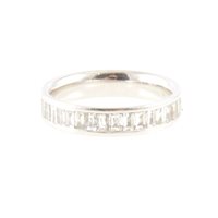 Lot 175 - A diamond half eternity ring, sixteen baguette cut stones channel set in a platinum mount