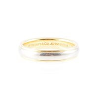 Lot 176 - Tiffany - an 18 carat yellow gold and platinum band 3.8mm wide D shape, the centre platinum with a border of yellow gold