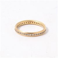 Lot 185A - A diamond full eternity ring, the brilliant cut stones, channel set in an all yellow metal full eternity mount 2.8mm wide, marked 18ct, ring size L.