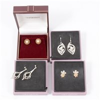 Lot 195A - Four pairs of earrings for pierced ears, a pair of 9  carat yellow gold rope design studs set with a 5.5mm cultured pearl, three pairs of silver earrings by Ola Gorie Scottish Originals. (4)