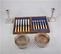 Lot 164 - A silver Scandanavian spoon, marked Thune 800, a boxed set of silver plated cutlery, other spoons and two bottle coasters.